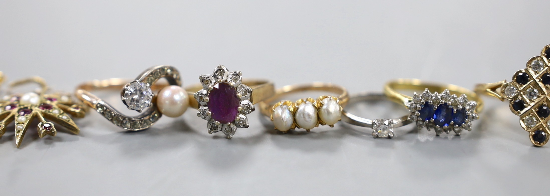 A modern platinum and solitaire diamond set ring, size G, gross weight 1.4 grams, four assorted 18ct gold and gem set rings including diamond chip half eternity and a pair of Italian 750 and cultured pearl earrings, gros